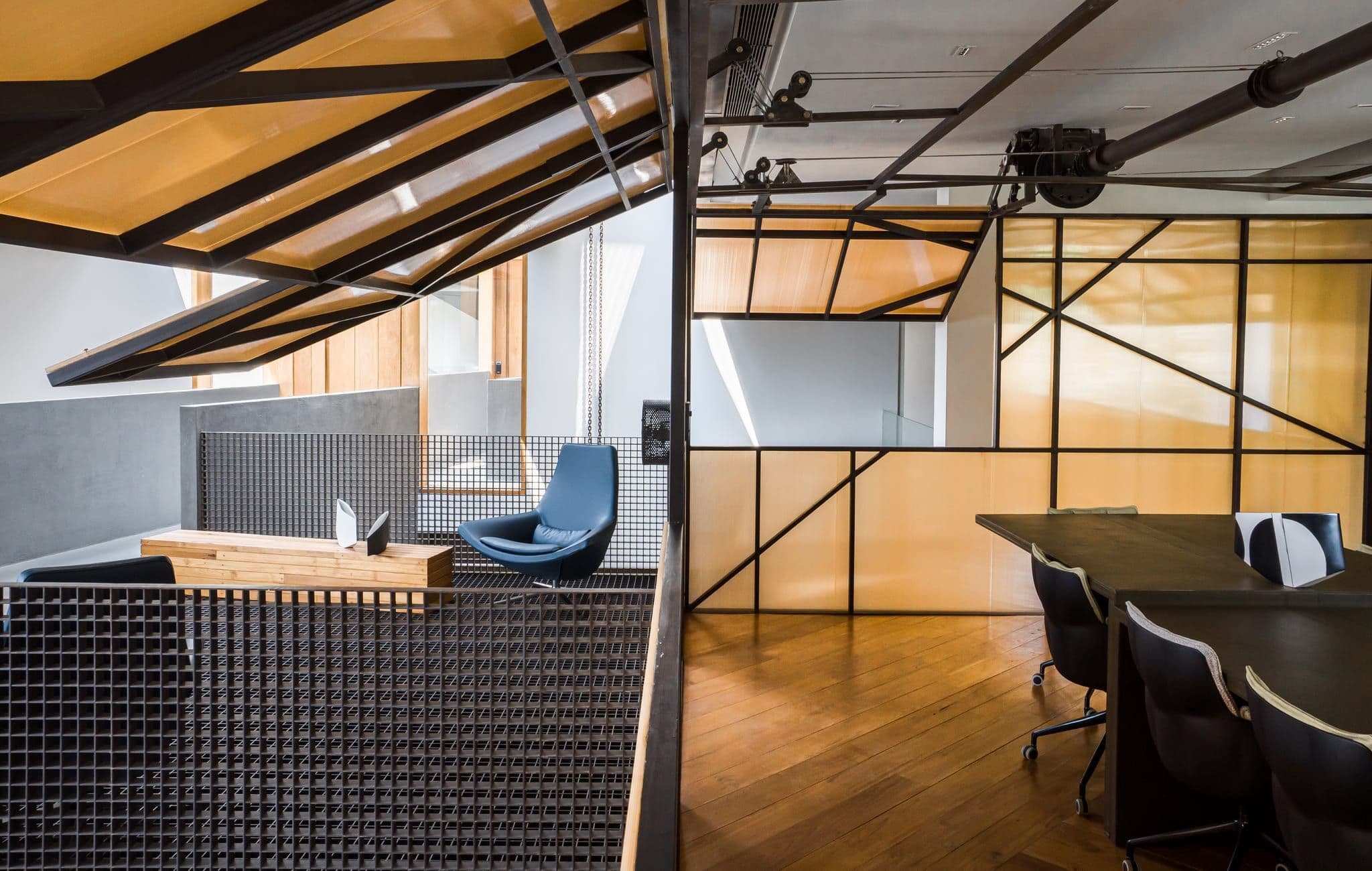Suspended amber conference room and workspace void