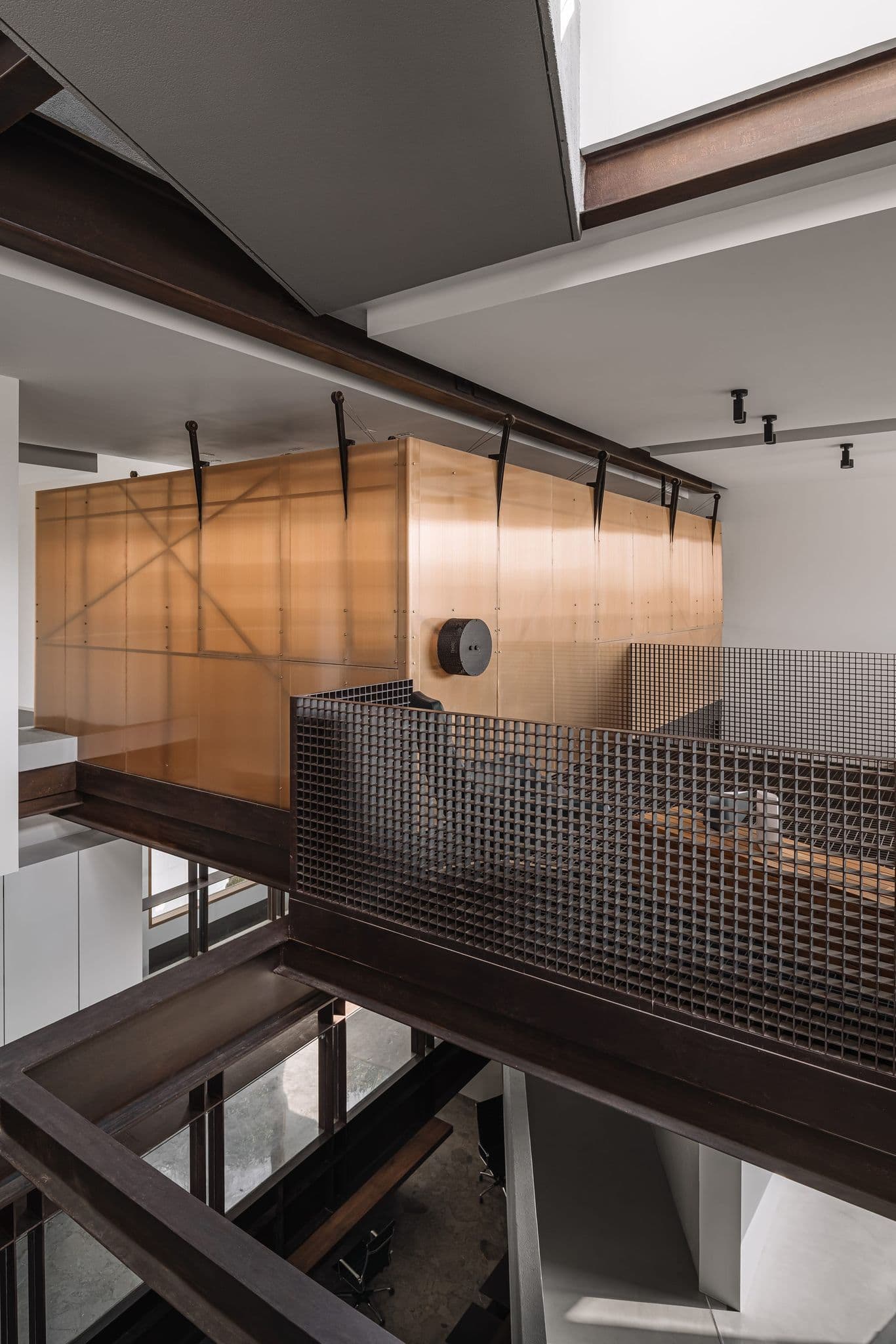 Conference room volume wrapped in amber panels