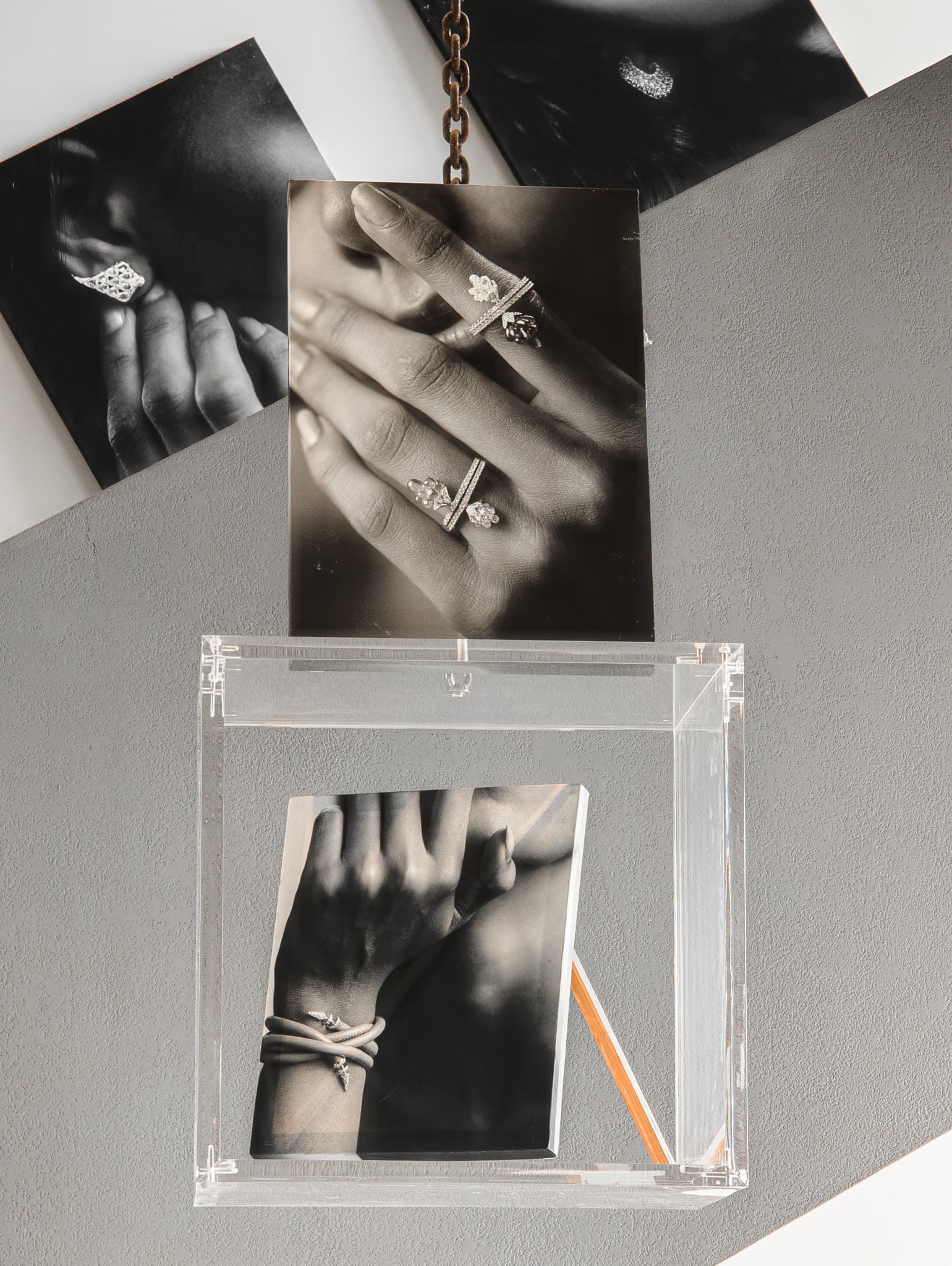 Hung prints and an acrylic case displaying a hand study